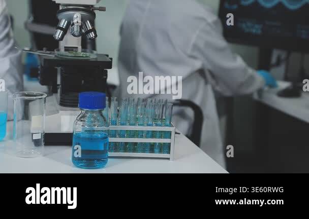 scientist with microscope in laboratory Stock Video Footage - Alamy