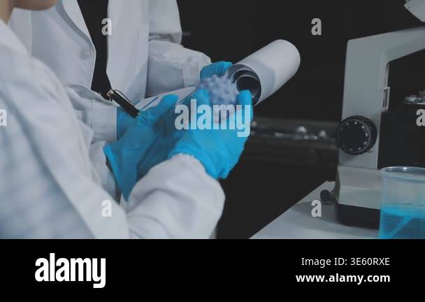 scientist in laboratory with microscope and test tube Stock Video ...