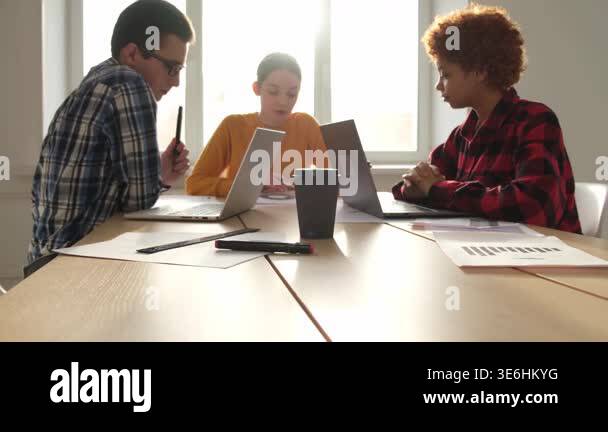 Team at work office meeting. Group of young business people working ...