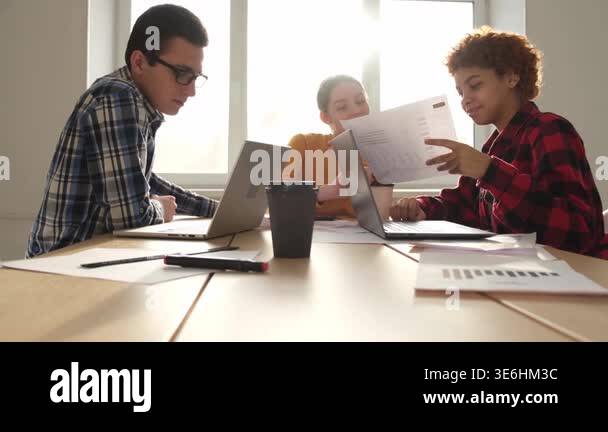 Team at work office meeting. Group of young business people working ...
