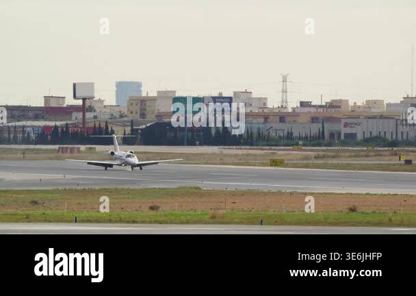 VALENCIA, SPAIN - JANUARY 23, 2026: A white private jet lands and slows ...