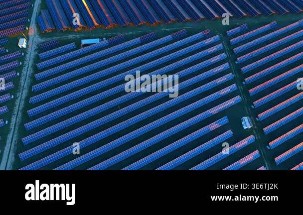 Solar Panel Direct View Aerial view of solar panel array at sunset light. High angle ...