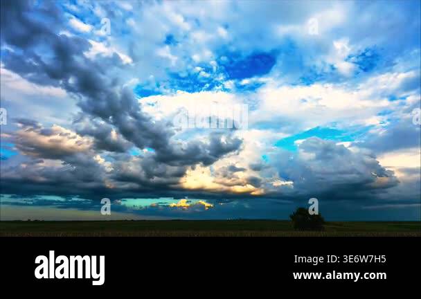 A dramatic view of a vast and moody sky filled with heavy storm clouds ...