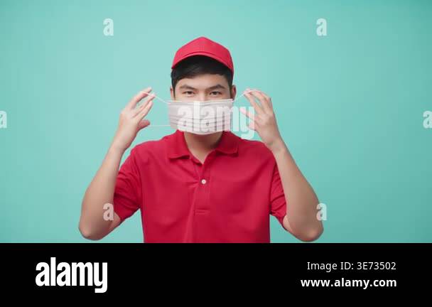 Person wearing red cap adjusting face mask Stock Video Footage - Alamy