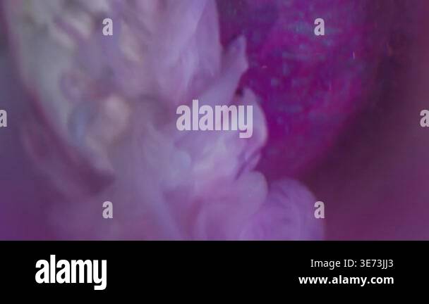 Vertical video. Ink explosion. Defocused swirl. White fume liquid ...