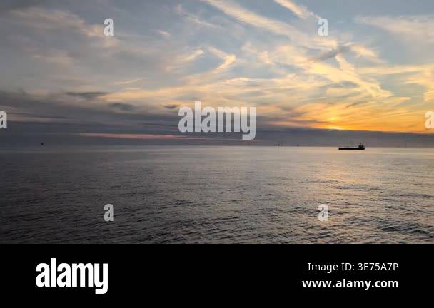 Sunset Ocean Horizon With Cargo Ship. Cinematic Golden Light Reflecting ...