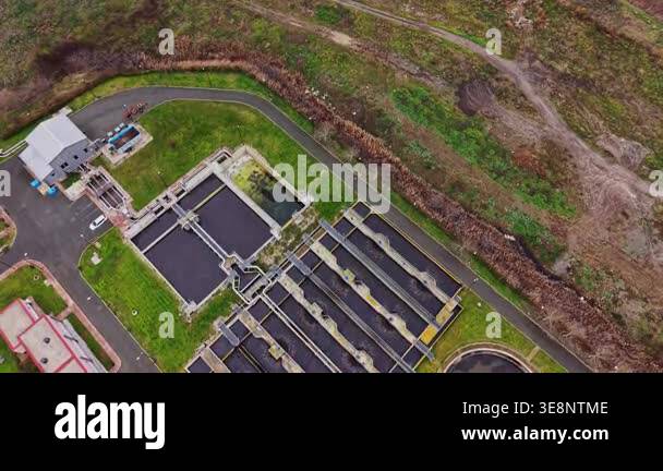 Aerial view of a water treatment facility showing various tanks ...
