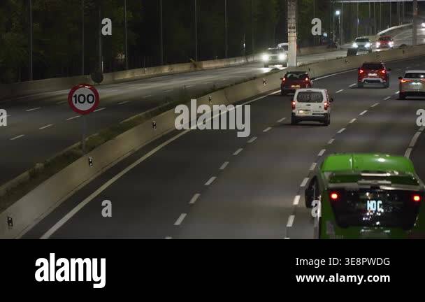 MADRID, SPAIN - JANUARY 13, 2026: Multilane urban highway at night with ...