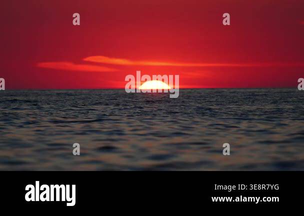 Romantic red sunset over ocean horizon, telephoto Italy landscape in 4K ...