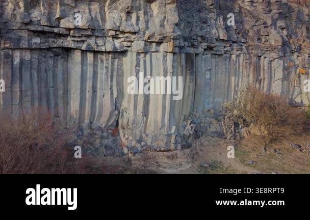 Natural rock formations with vertical columns in a rugged environment ...
