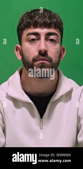 Young handsome man showing a transparent dental aligner to the camera ...