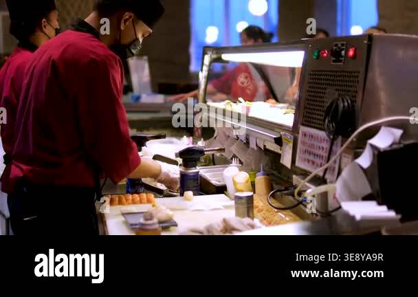 Street food energy and hygiene focus: chefs in masks wearing red ...