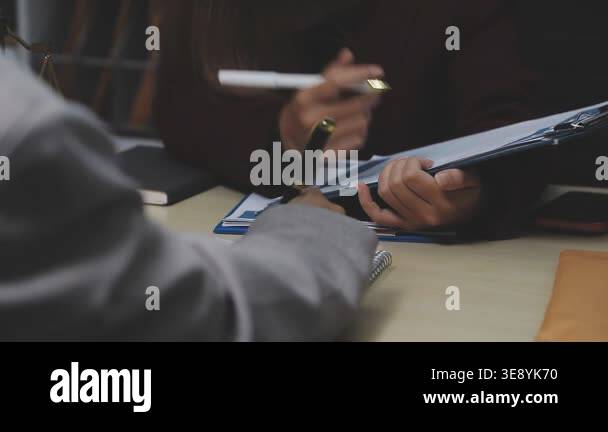 close up of businessmen writing notes in a notebook in the office Stock ...