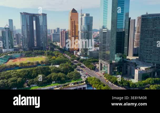 An aerial view of a modern city skyline showing tall skyscrapers and a ...