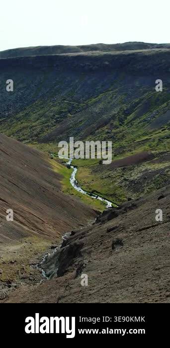 Iceland, river in a mountain valley, northern landscape from height ...