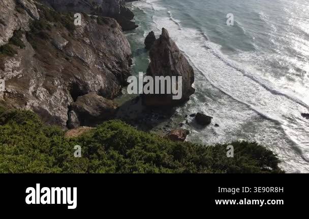 Aerial view of ocean waves crashing on rocky coast. Beautiful aerial ...