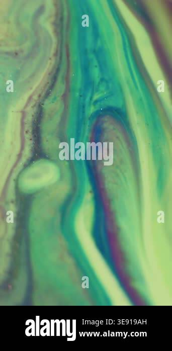 Vertical video. Shiny particles. Blur mix ink. Defocused blue yellow ...