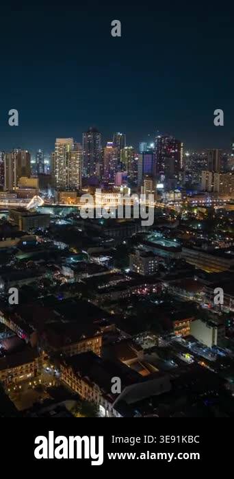 Aerial night timelapse of Manila skyline in the Philippines, featuring ...