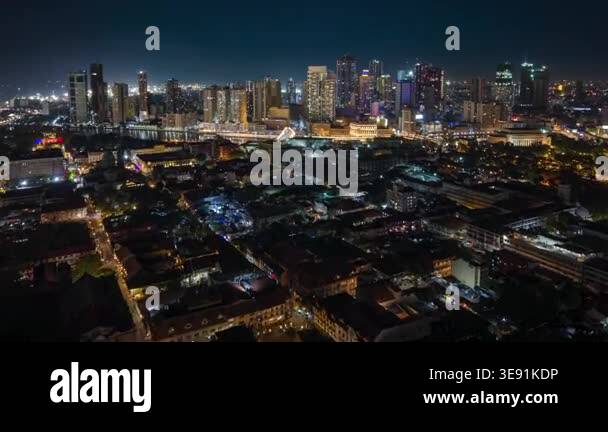 Aerial night timelapse of Manila skyline in the Philippines, featuring ...