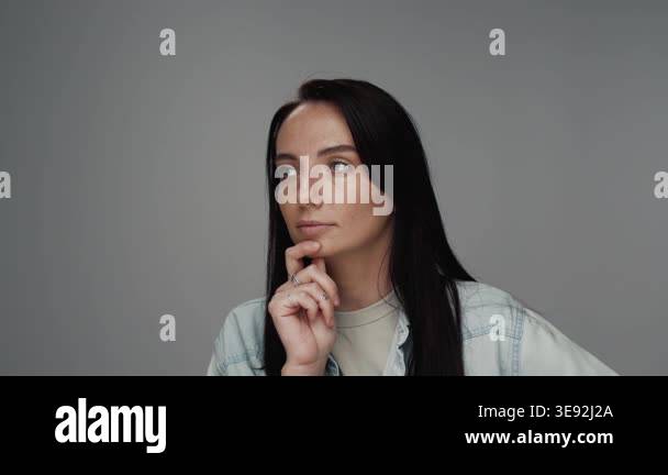 Portrait of Young Woman Looking at Camera in Colour Studio Shot. Adult ...
