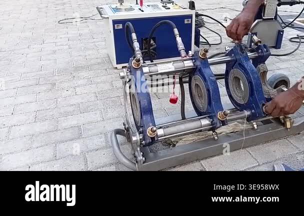 Authentic video of a worker preparing a hydraulic butt fusion welding ...