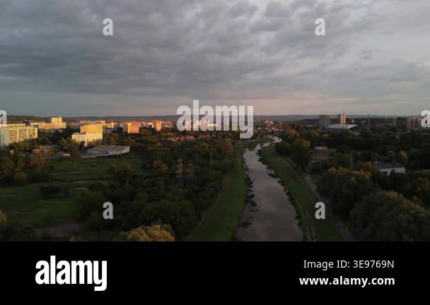 Aerial evening view of a city skyline with residential buildings and a ...