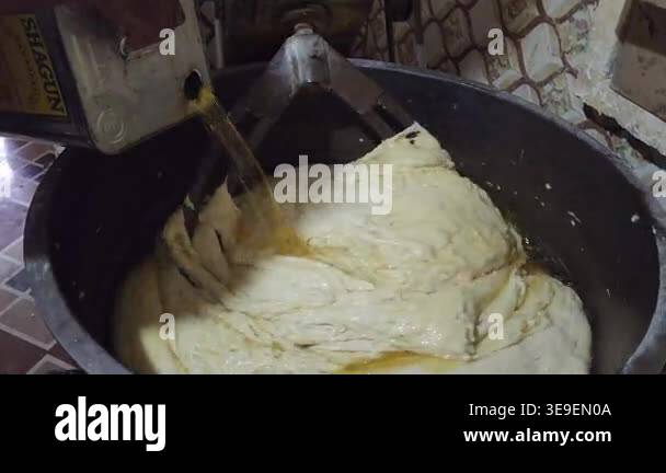 cooking process of the preparation of the dumplings, a large dough with ...