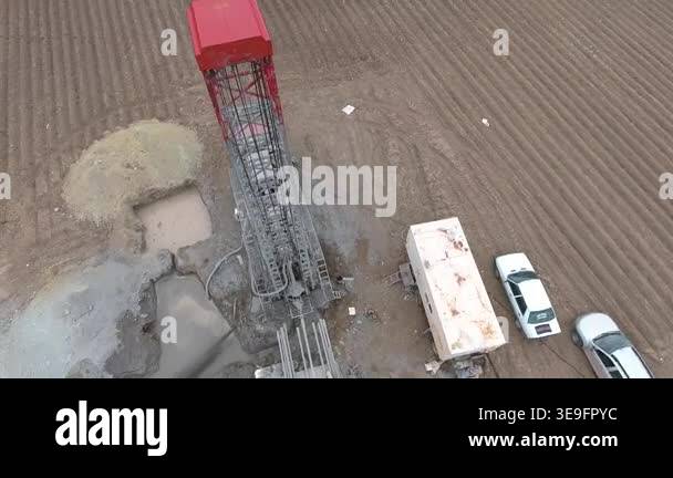 Drilling Rig In Rural Aerial view of a drilling rig extracting groundwater from a flat ...