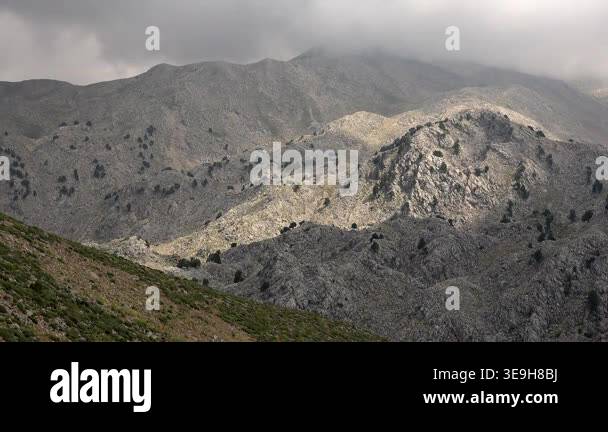 Timelapse shows rocky mountains and plateaus beneath cloudy summer ...