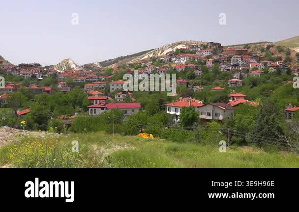 Turkish Rural Panoramic Anatolian town with traditional houses spread across green ...