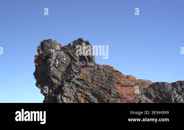 Frozen basalt lava rocks showing porous vesicular texture formed by ...