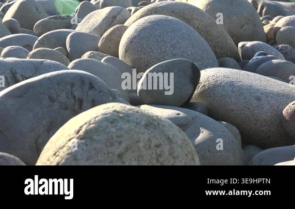 Smooth Rocks Together Smooth gray stones and pebbles in closeup, rounded river rocks creating ...