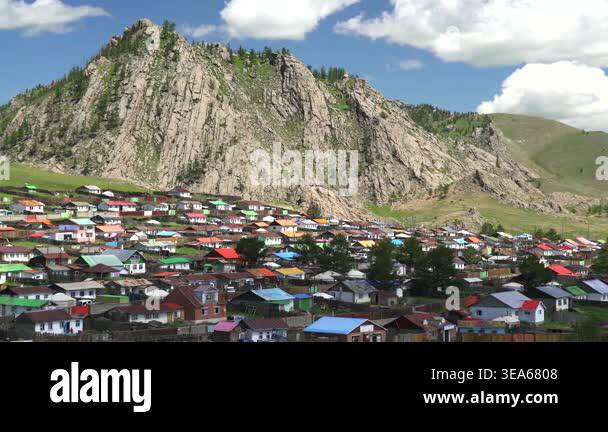 Mongolian ger tents stand in wide steppe meadow, showing traditional ...