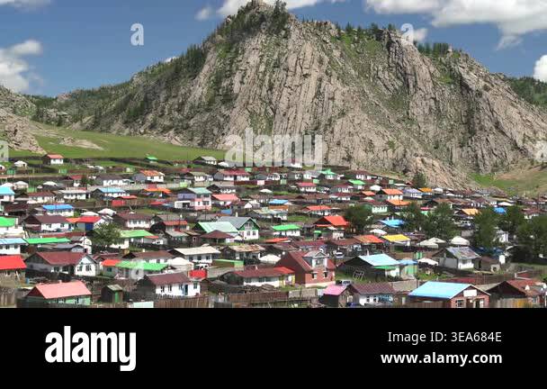 Mongolian ger tents stand in wide steppe meadow, showing traditional ...
