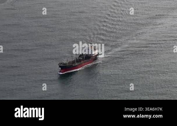 High angle aerial view of a large oil or chemical tanker ship cruising ...