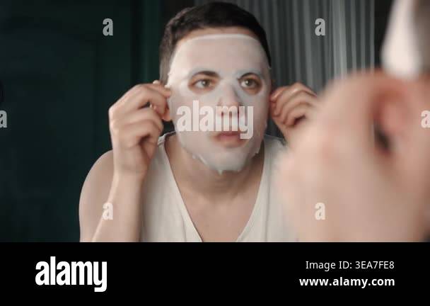 A European-looking man spends the morning in the bathroom performing ...