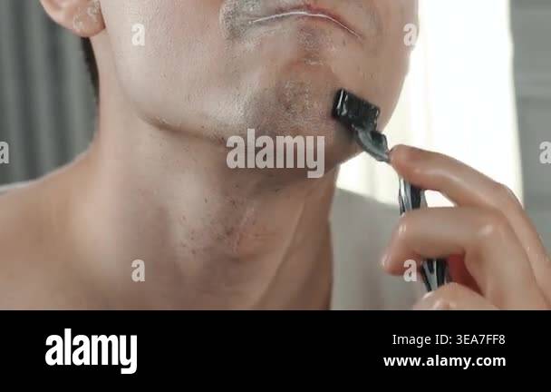 A European-looking man spends the morning in the bathroom performing ...