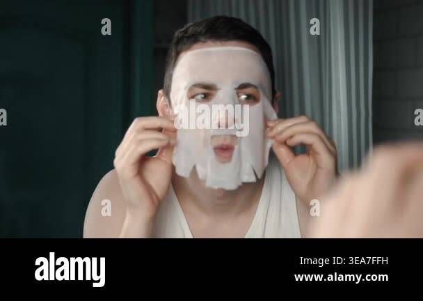 A European-looking man spends the morning in the bathroom performing ...