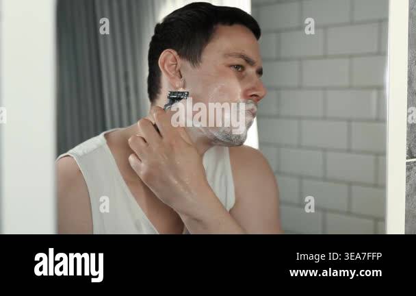 A European-looking man spends the morning in the bathroom performing ...