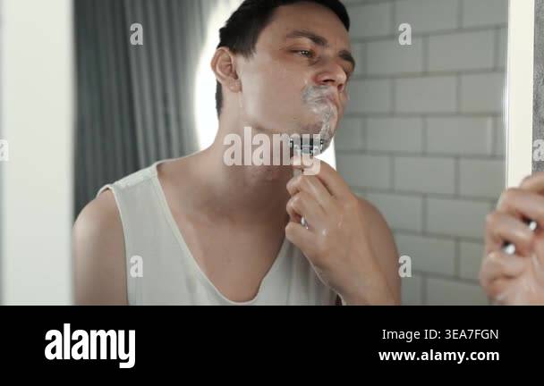 A European-looking man spends the morning in the bathroom performing ...