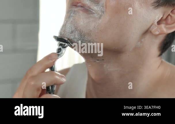 A European-looking man spends the morning in the bathroom performing ...