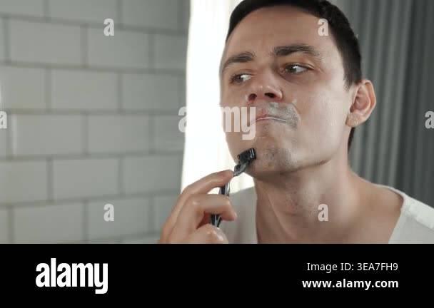 A European-looking man spends the morning in the bathroom performing ...