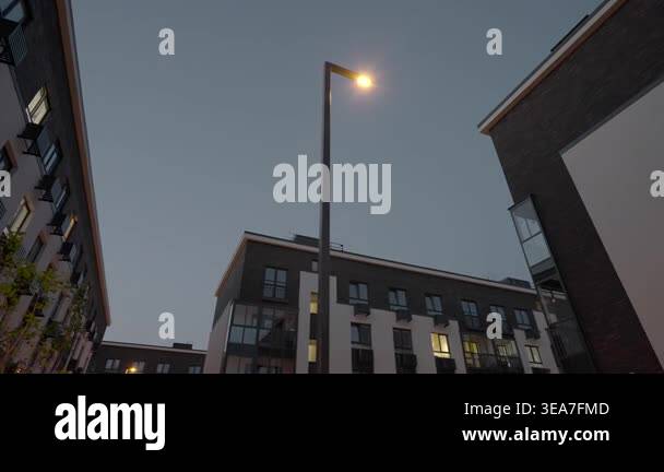 Nighttime Streetlamp Casting Warm Glow Over Residential Block, Lit ...