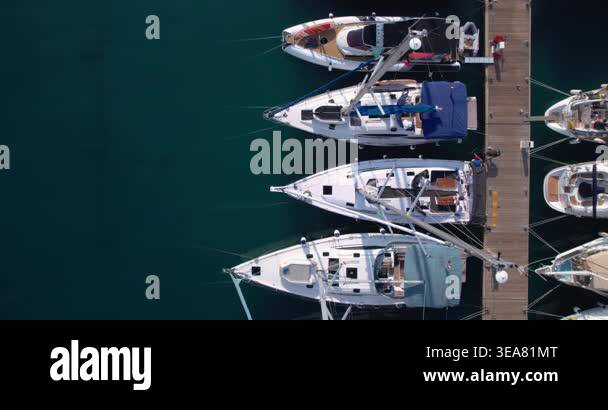 Overhead Marina Berths With Boats Lined Along Wooden Jetty, Varied ...