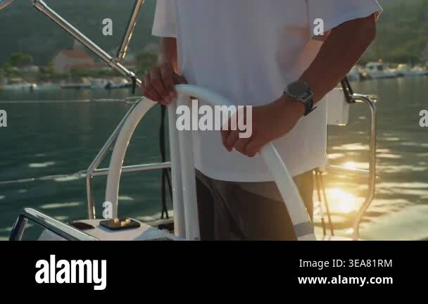 Caucasian Helmsman Hands On Wheel, Golden Sunset Glow Reflecting On ...