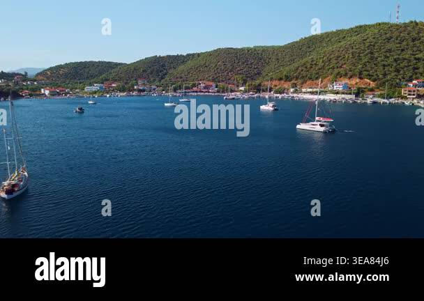 High angle drone shot of sailboats moored in the calm protected waters ...