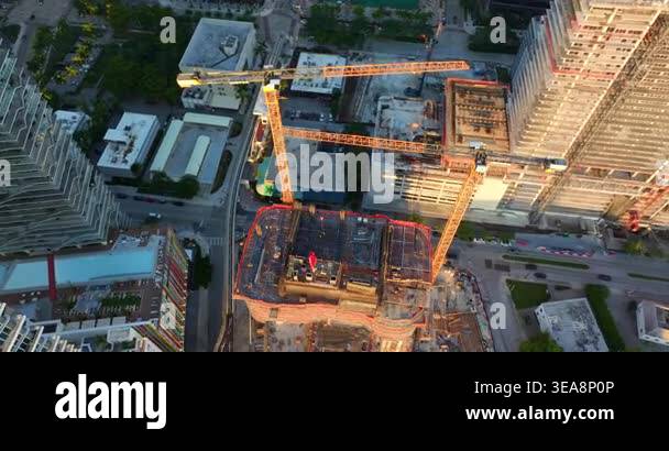 New skyscraper construction in Miami, Florida at sunset. Developing ...