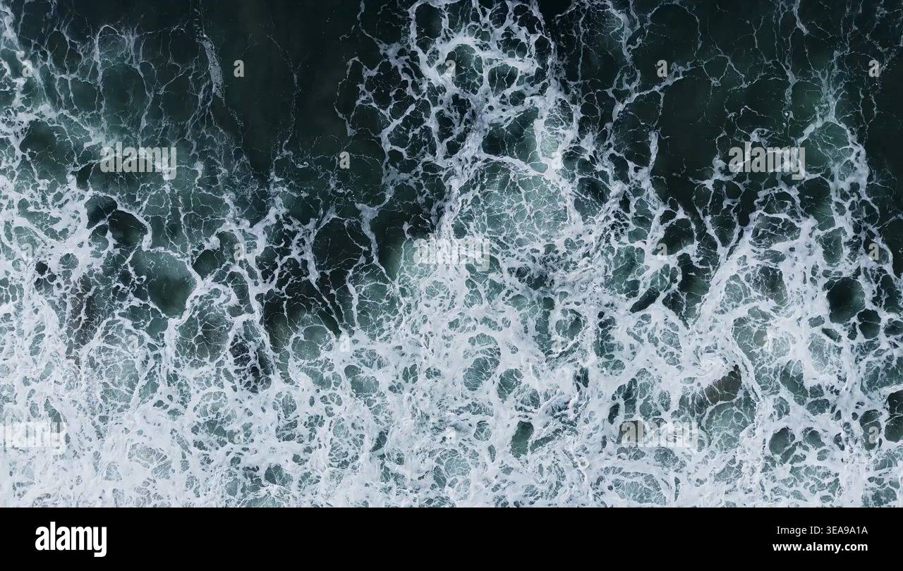 Aerial View of Ocean Waves Crashing on Shore Stock Video Footage - Alamy