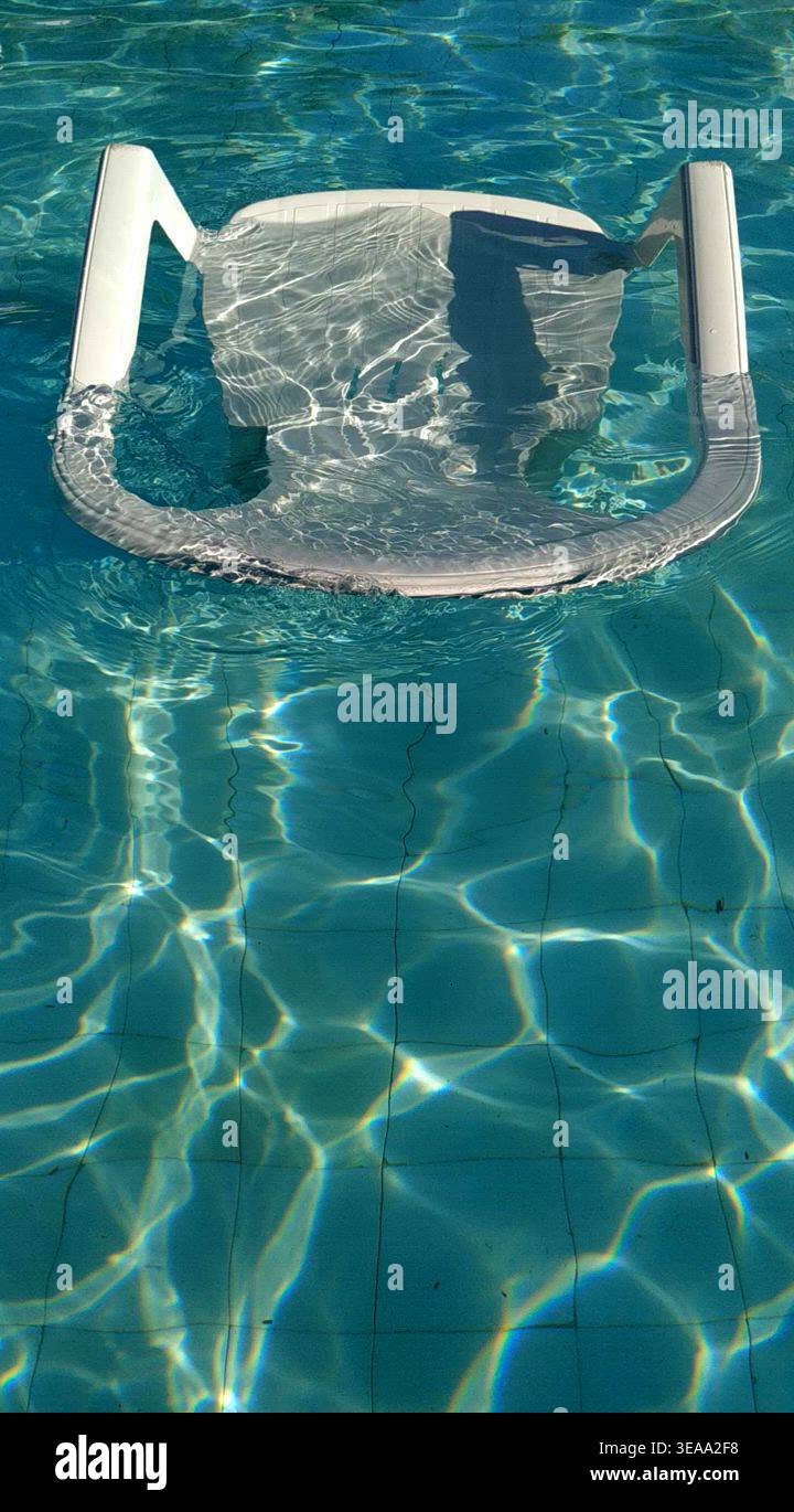 Chair in swimming pool Stock Video Footage - Alamy