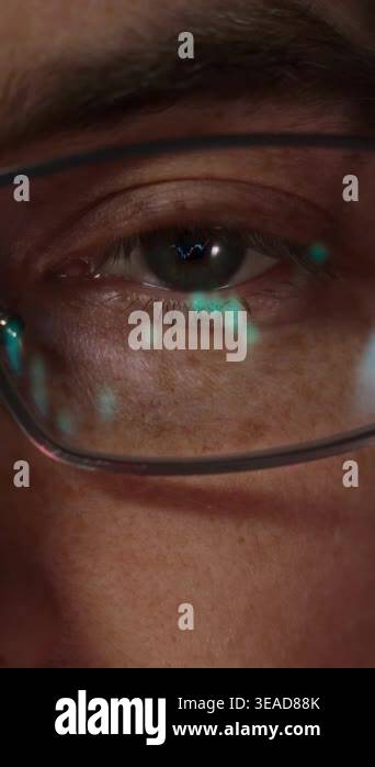 Close-up of a male trader eye with candlestick charts and financial ...